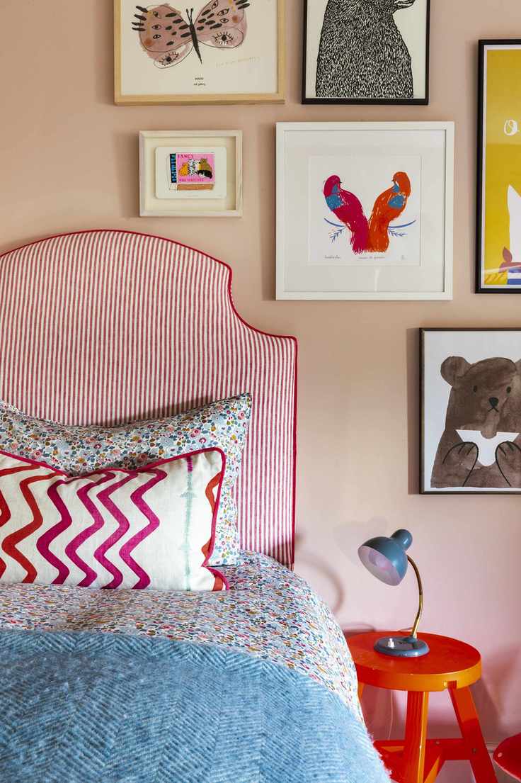 Red and white stripped headboard, orange bedside table