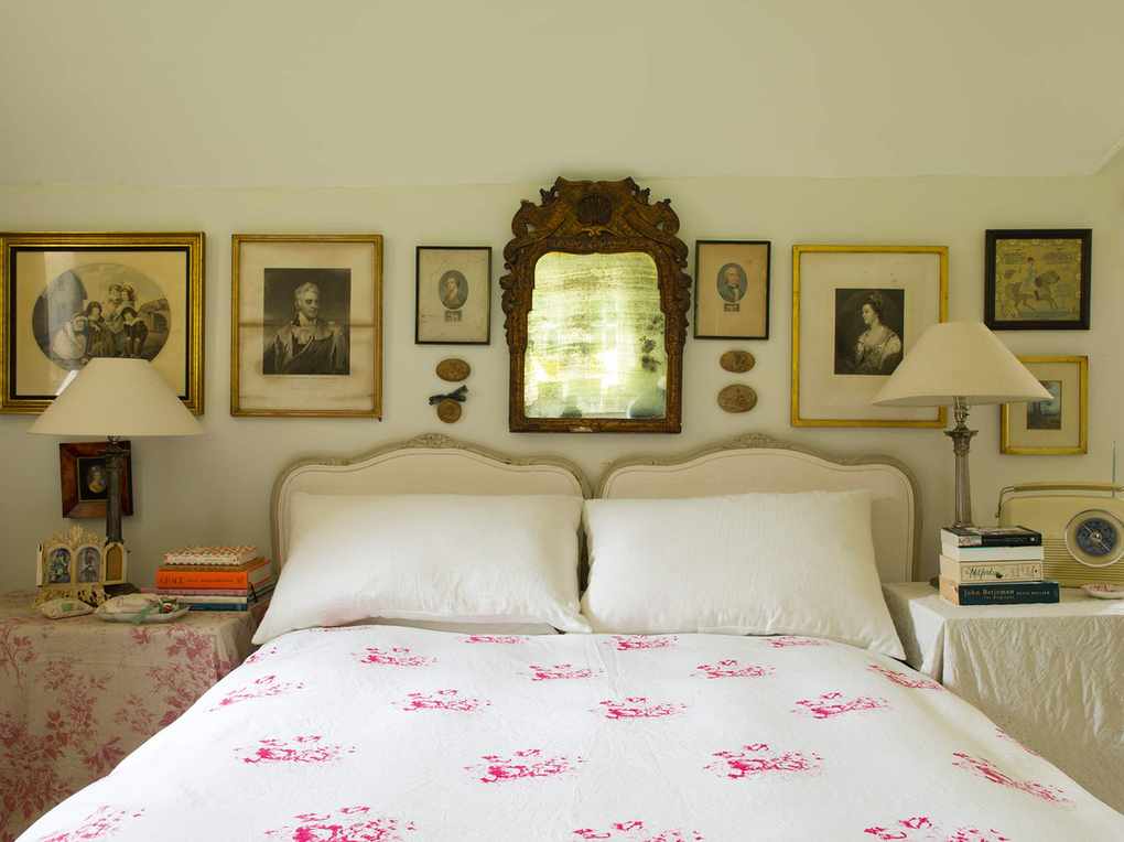 Cottage bedroom adorned with antique accessories around the bed