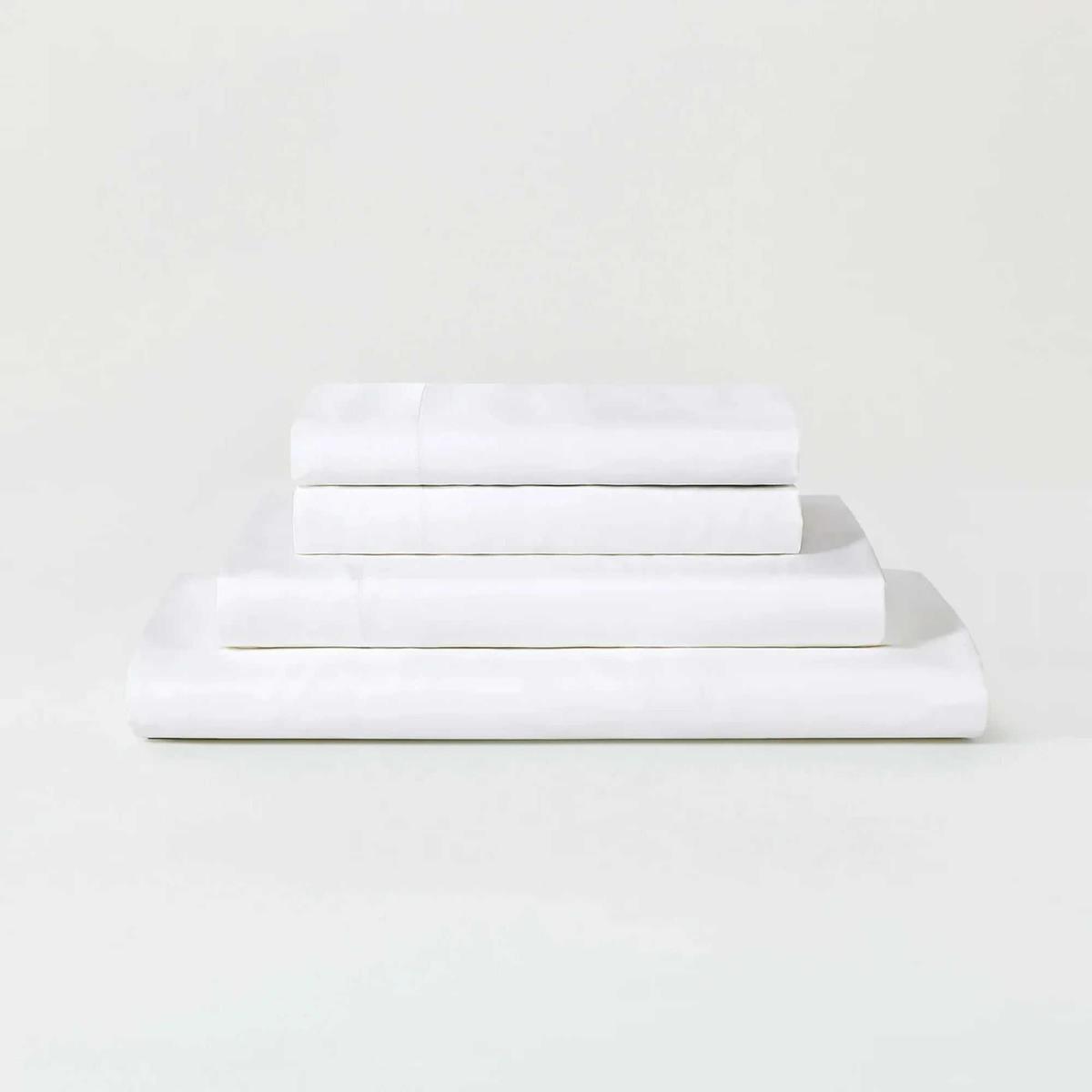 A white Sijo AiryWeight Eucalyptus Sheet Set folded and stacked