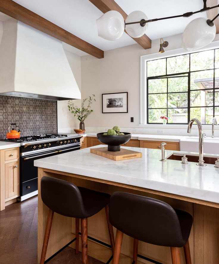 A transitional kitchen with wooden cabinets, white countertops, and patterned tiles for the backsplash
