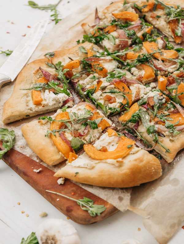 butternut squash flatbread with arugula and almond ricotta sliced