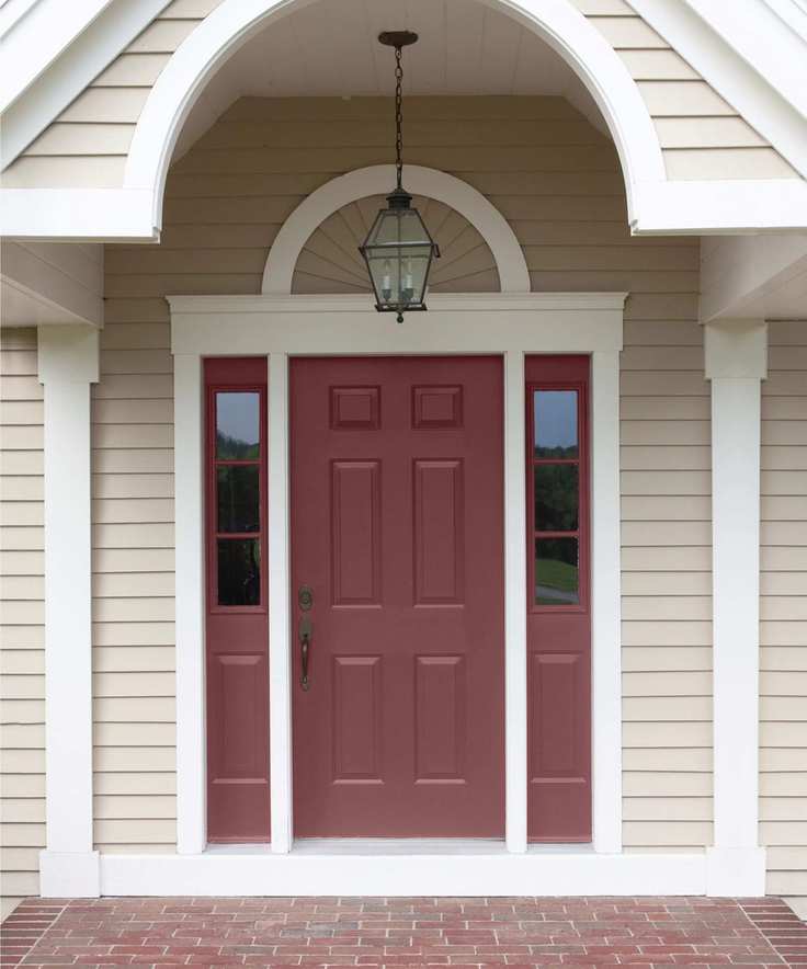 neutral home exterior with dark red front door