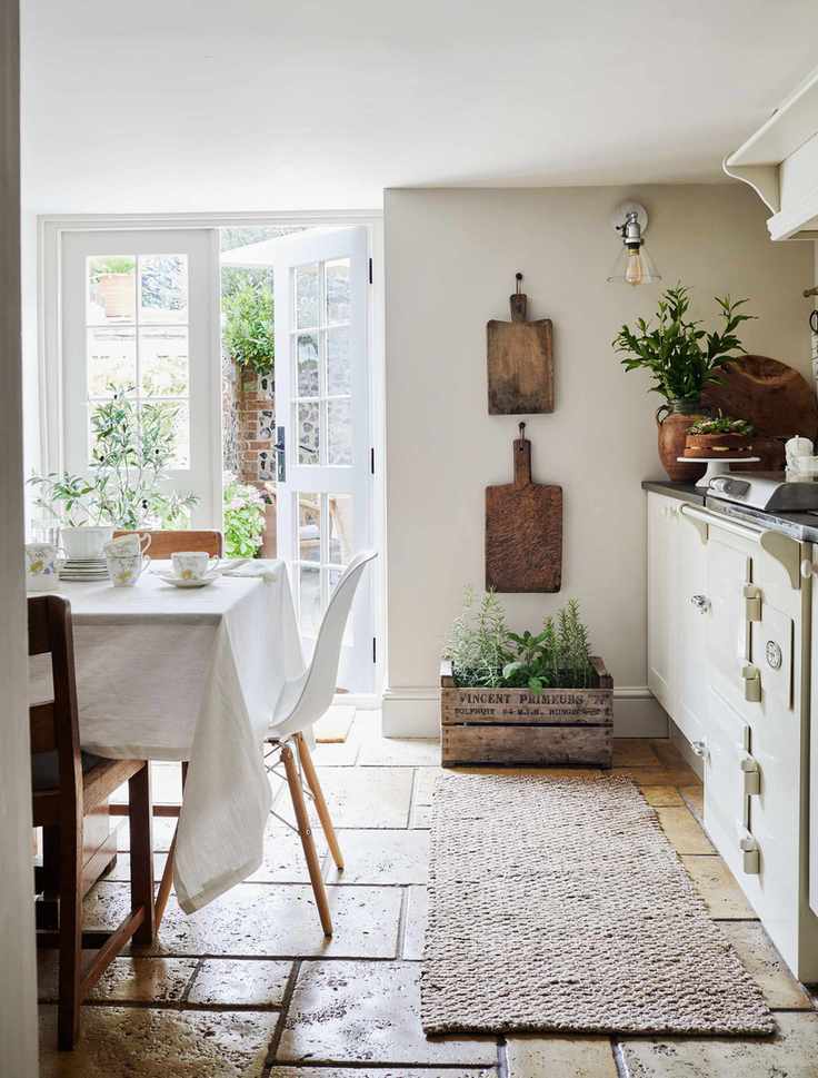 kitchen with white cabinets and french windows with herb box