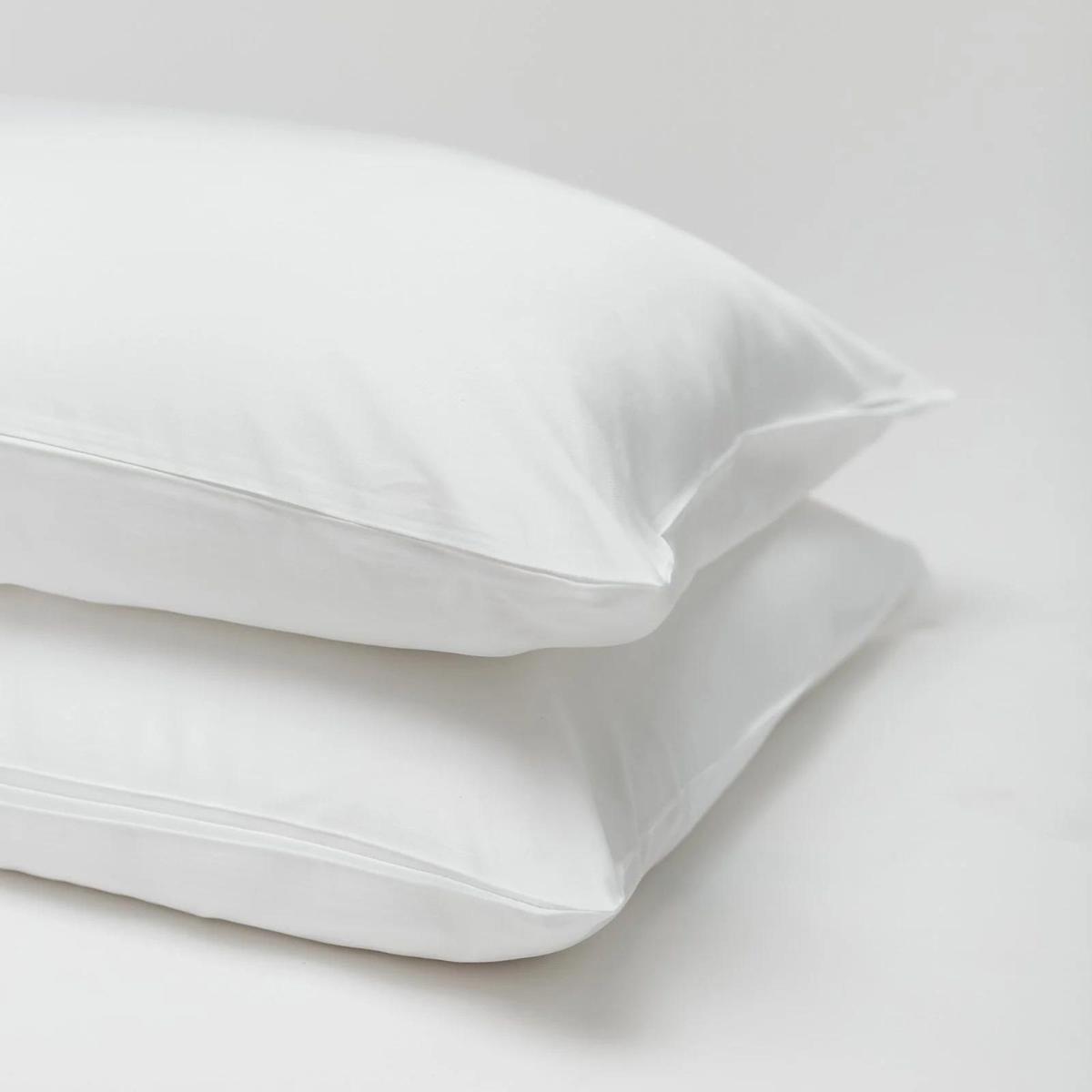 Cozy Earth Silk Pillow against a gray background.