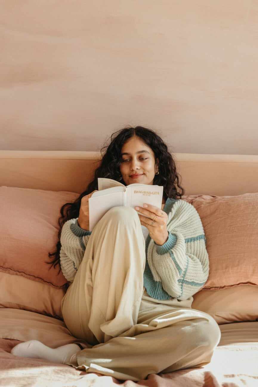 Woman reading bhagavad gita