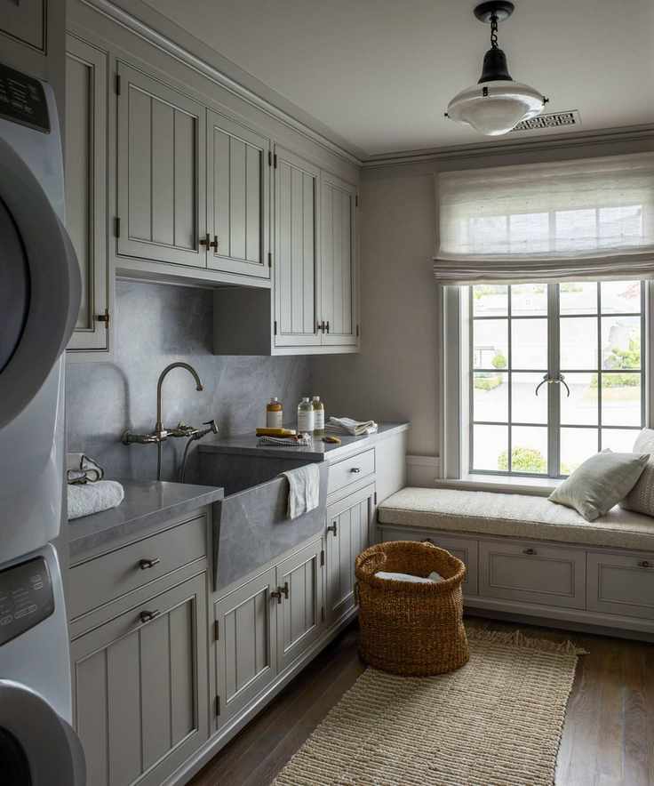 Shaker laundry room with bench seat under window