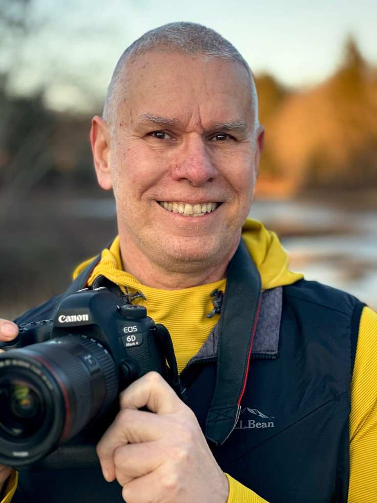 Matt Mattus holding a camera