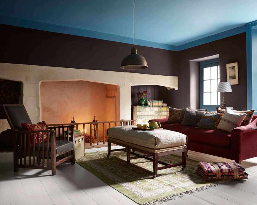 Brown painted living room with blue ceiling