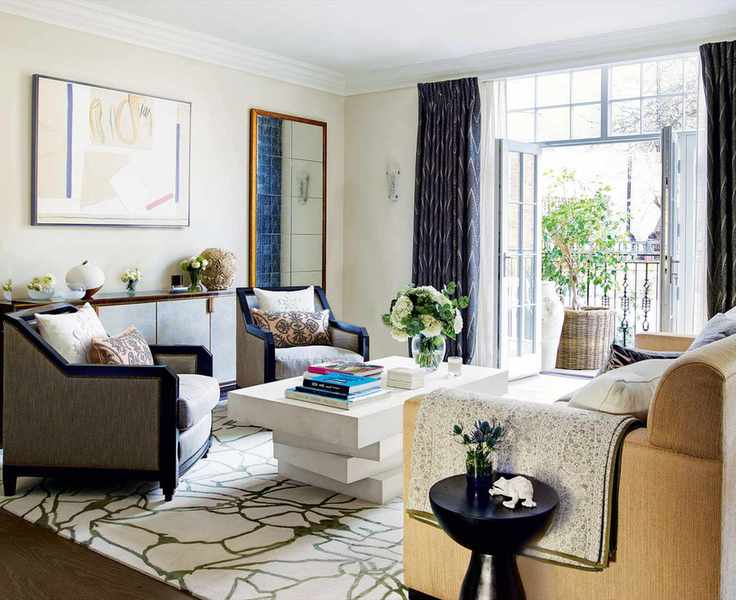 Elegant beige living room with traditional furniture and rich drapes.