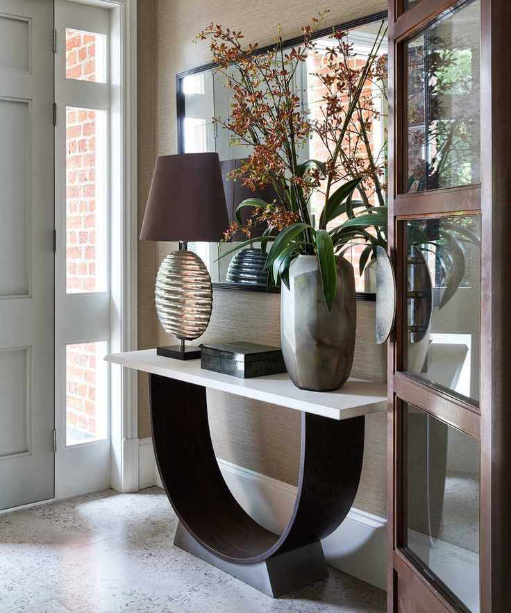 A modern hallway featuring a stylish console table