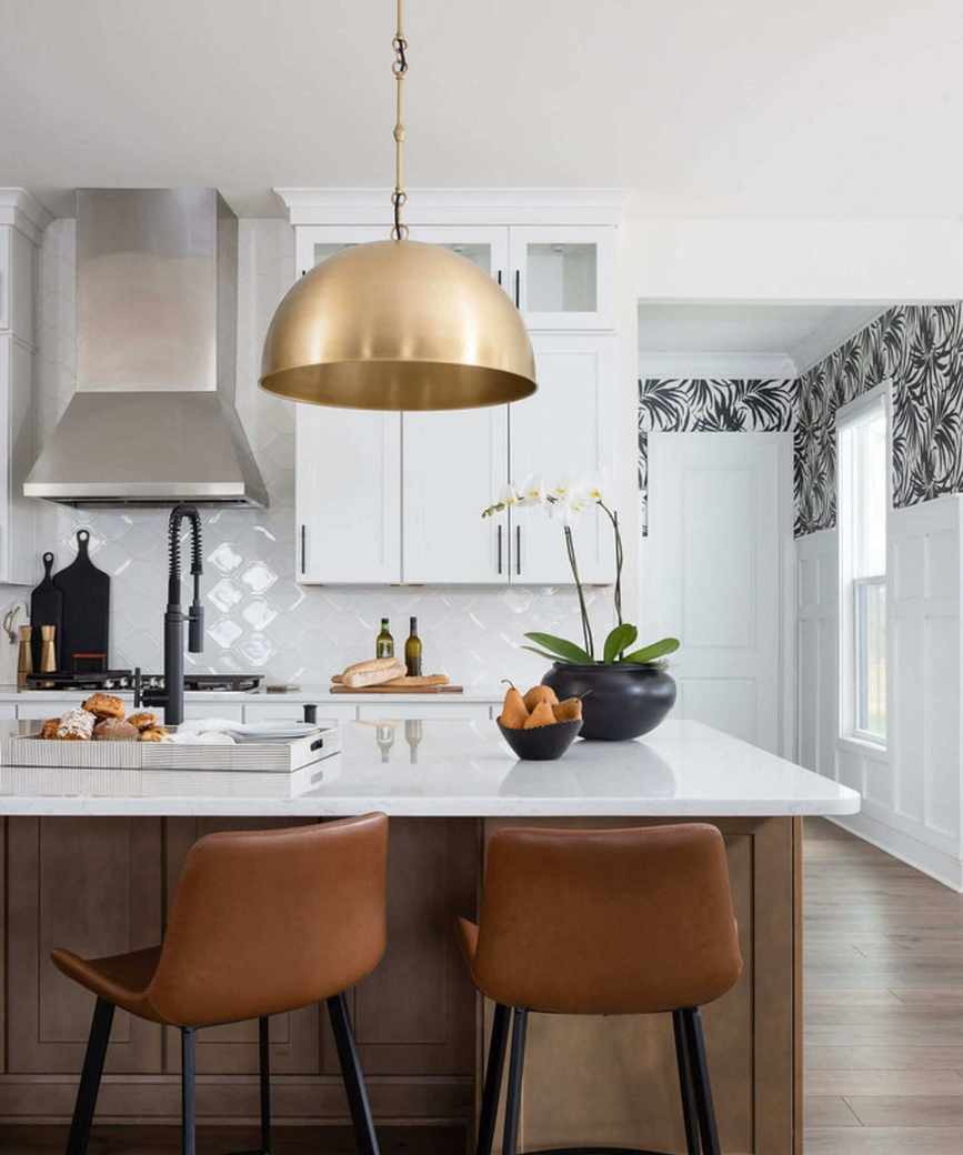 Large gold kitchen pendant lighting above an island