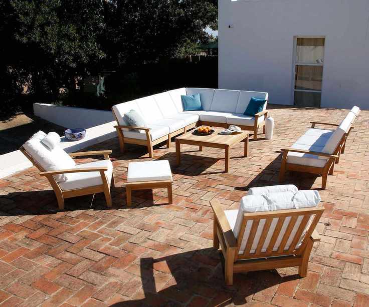 Teak outdoor furniture set on a patio