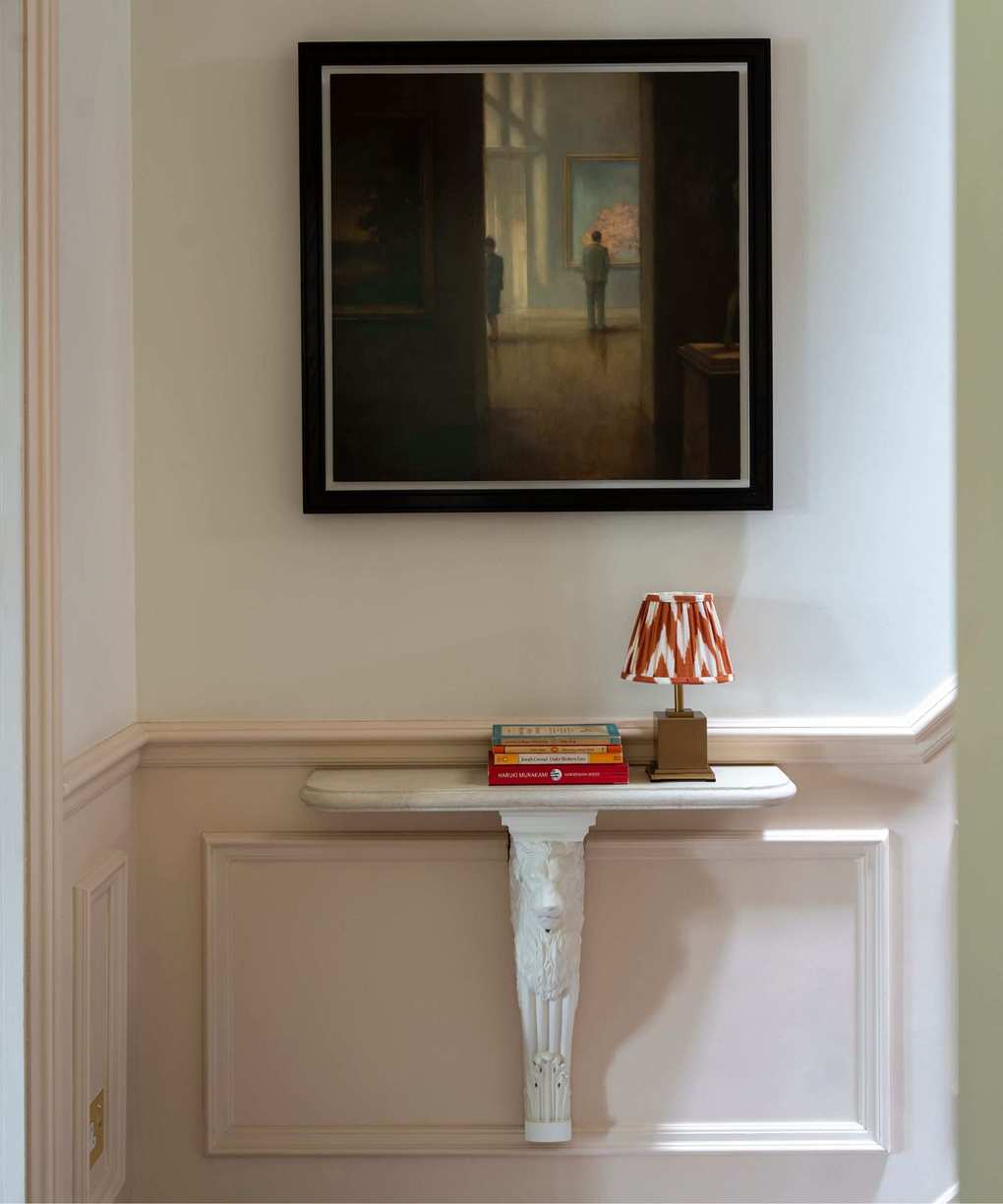 A stylish stairway adorned with books and artwork