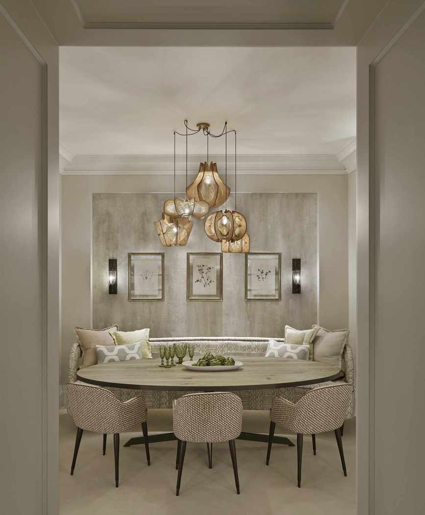 neutral dining with oval table, bench and chair seating, artwork, wall lights and statement pendant