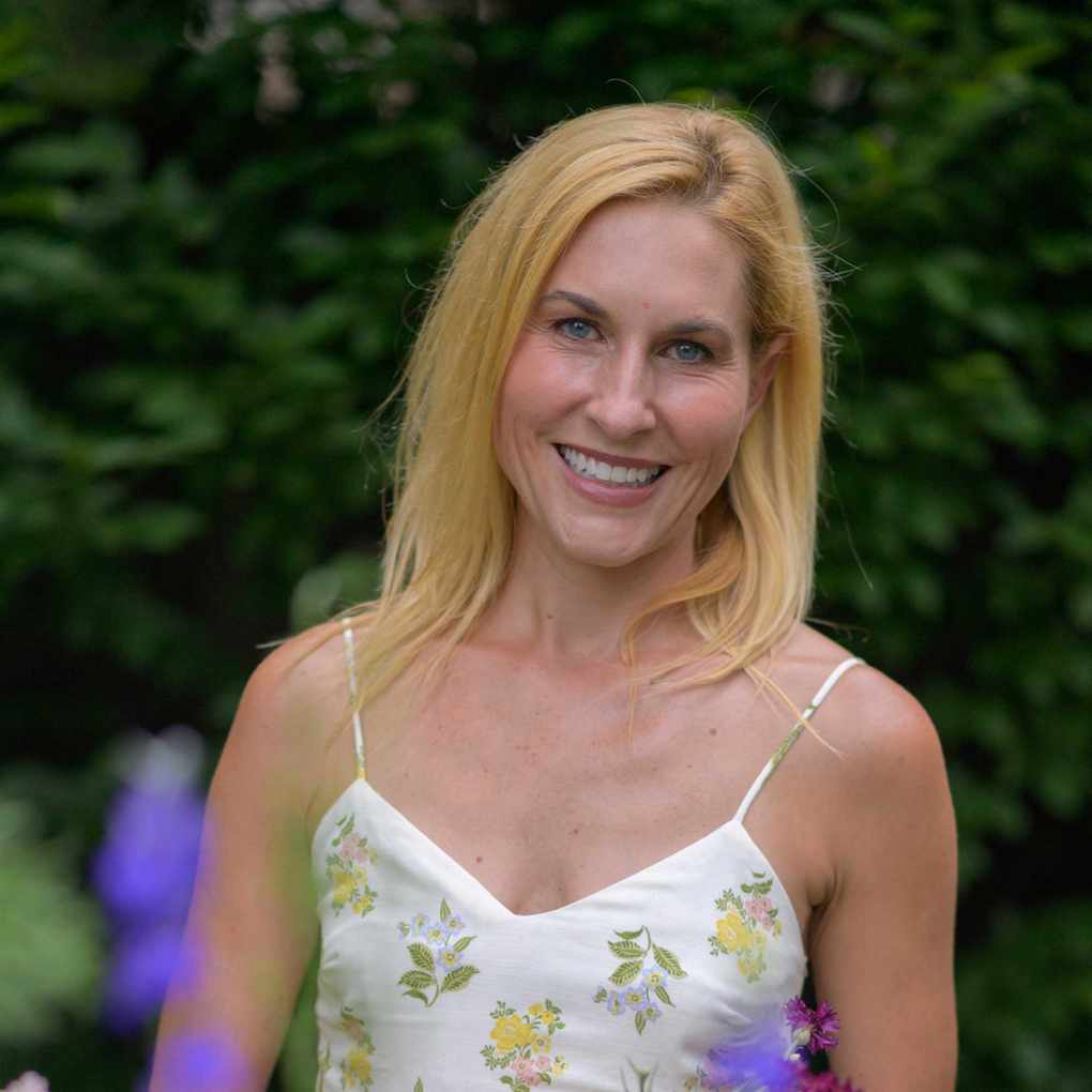 smiling headshot of Meredith Bishop wearing a dress