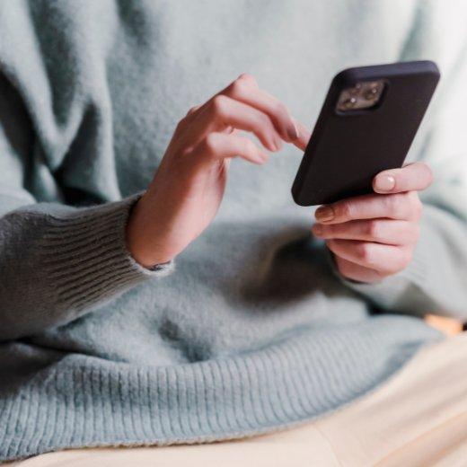 Person scrolling on phone