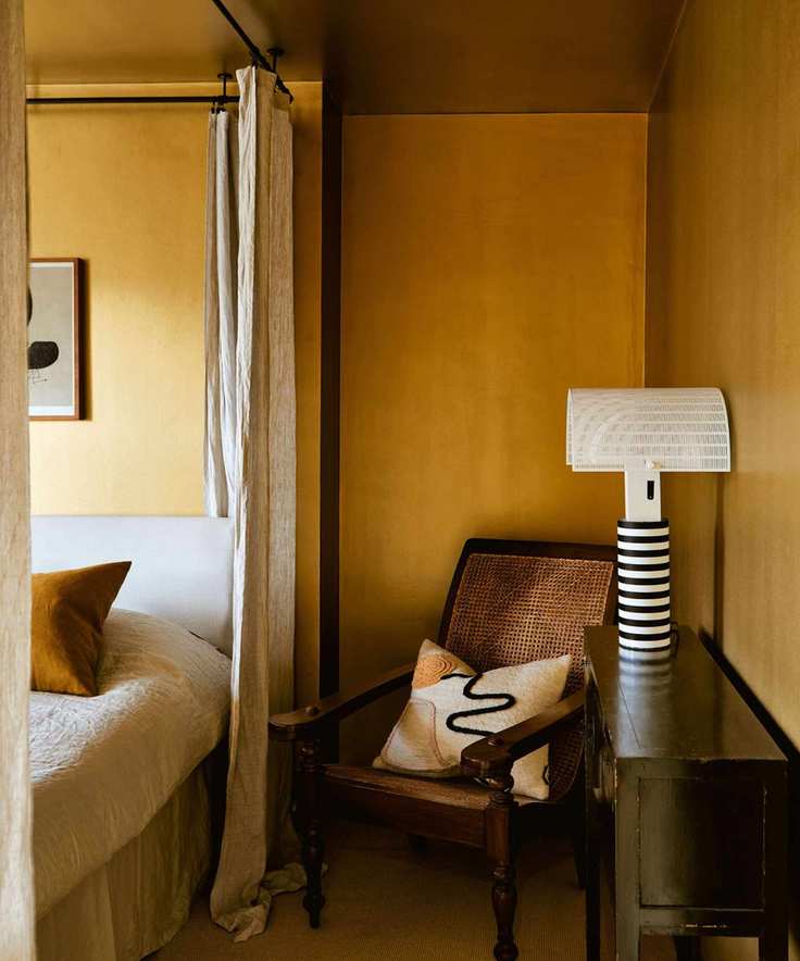 deep ochre yellow color drenched bedroom