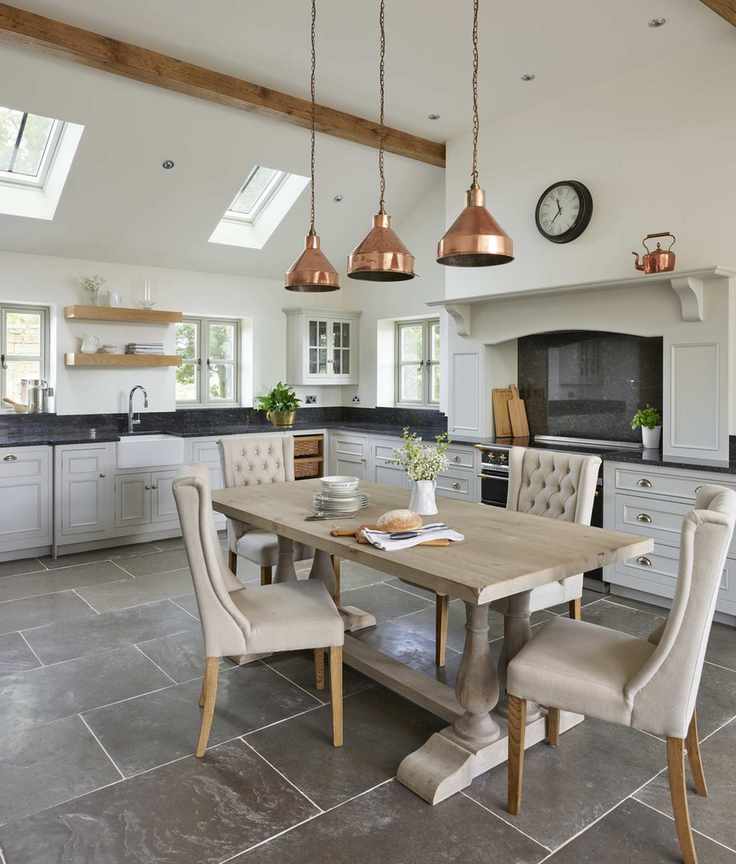 Grey country kitchen diner with table and upholstered chairs