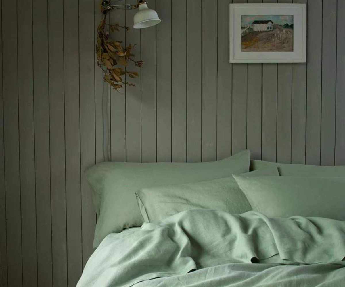 Close up on Piglet in Bed Sage Green Pillowcases.