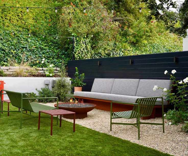 modern gravel patio area with fire pit and seating