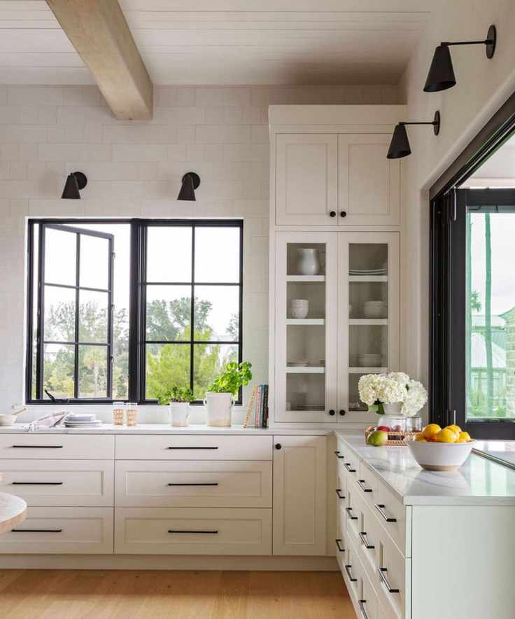 Herlong Architecture and Interiors white kitchen with black hardware photograph Julia Lynn