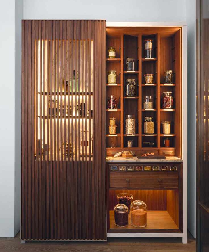 Large larder with sleek fluted wooden door