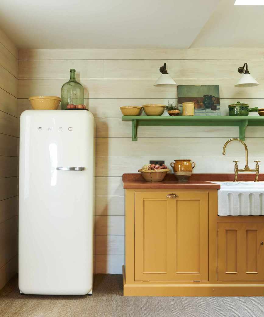 Kitchen with a 60s style white smeg fridge