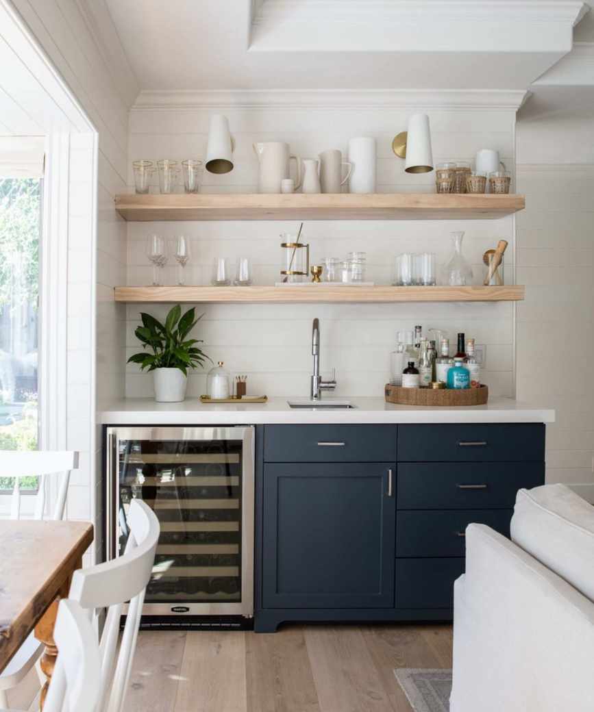 Home bar with navy blue cabinetry