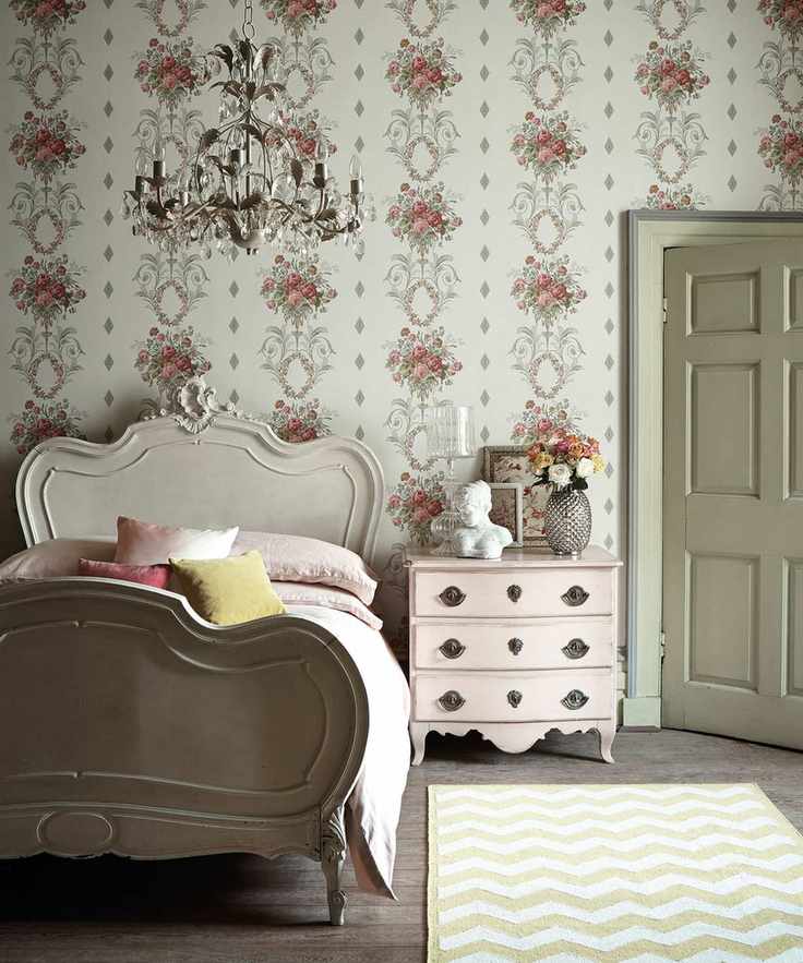 French country bedroom with patterned wallpaper