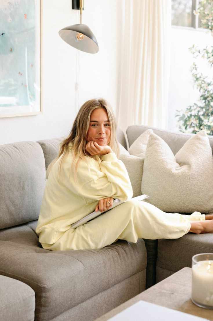 Mary Ralph sitting on couch.