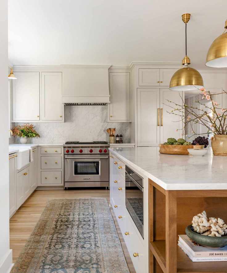 modern neutral kitchen with Shaker cabinets and marble island and gold pendant light