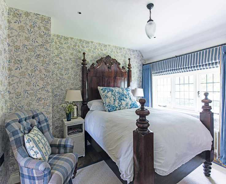 Cottage bedroom featuring checks, stripes, and chintz