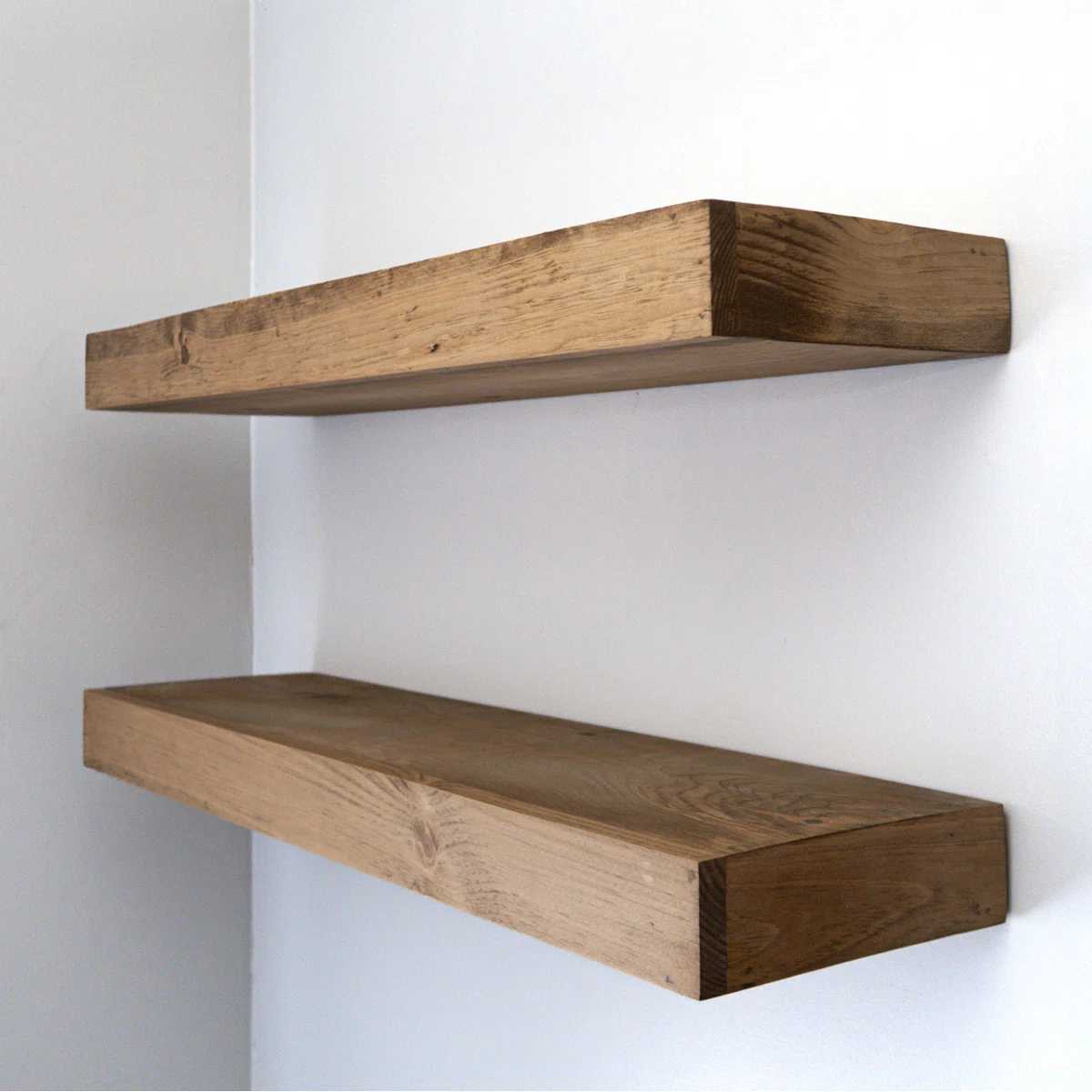 Two rustic wooden floating shelves