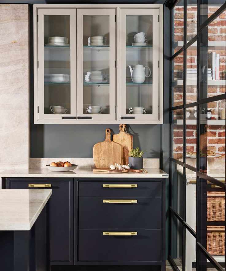 Black and white kitchen featuring gold and black hardware