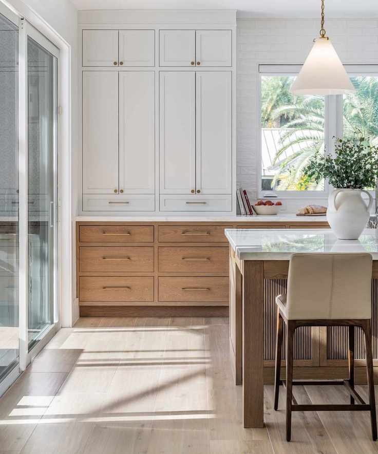 wood and white kitchen with marble island