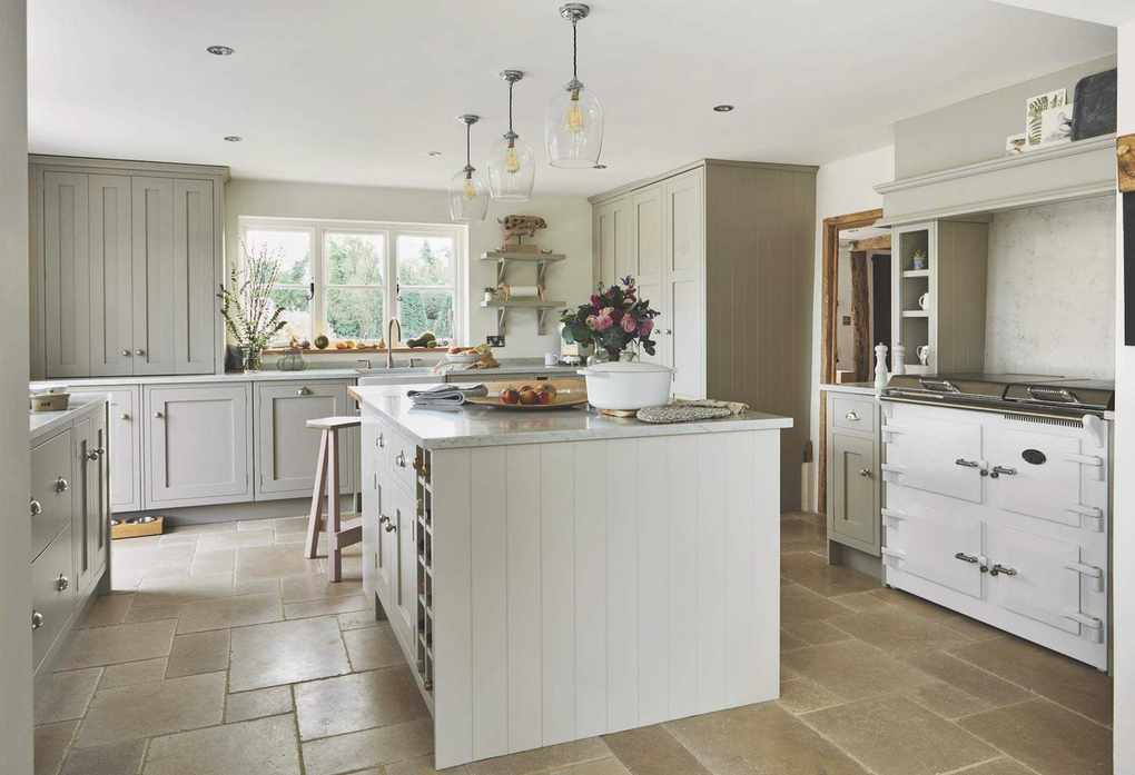 putty color large traditional kitchen with central island and wooden flooring