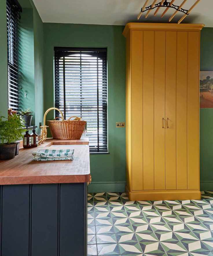 Colourful kitchen with yellow freestanding cabinet