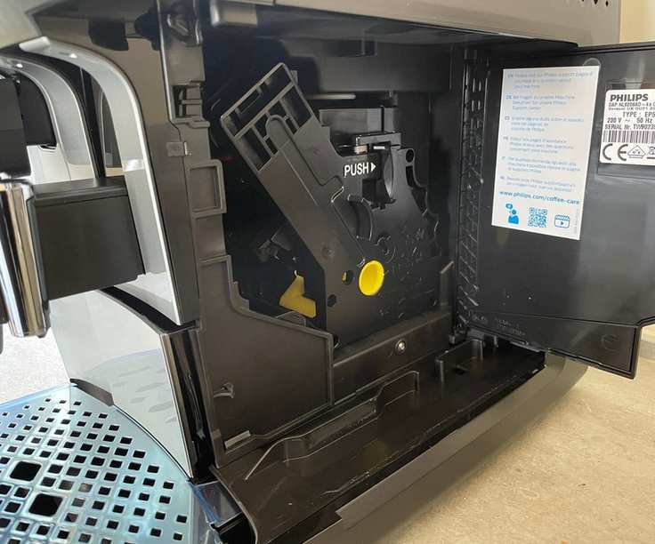 Philips 5400 Series LatteGo with the side door open showing the mechanisms inside