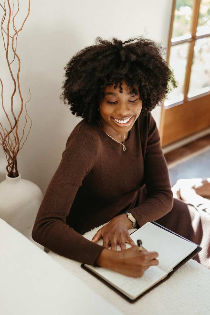 Woman journaling_interesting insights on gut health