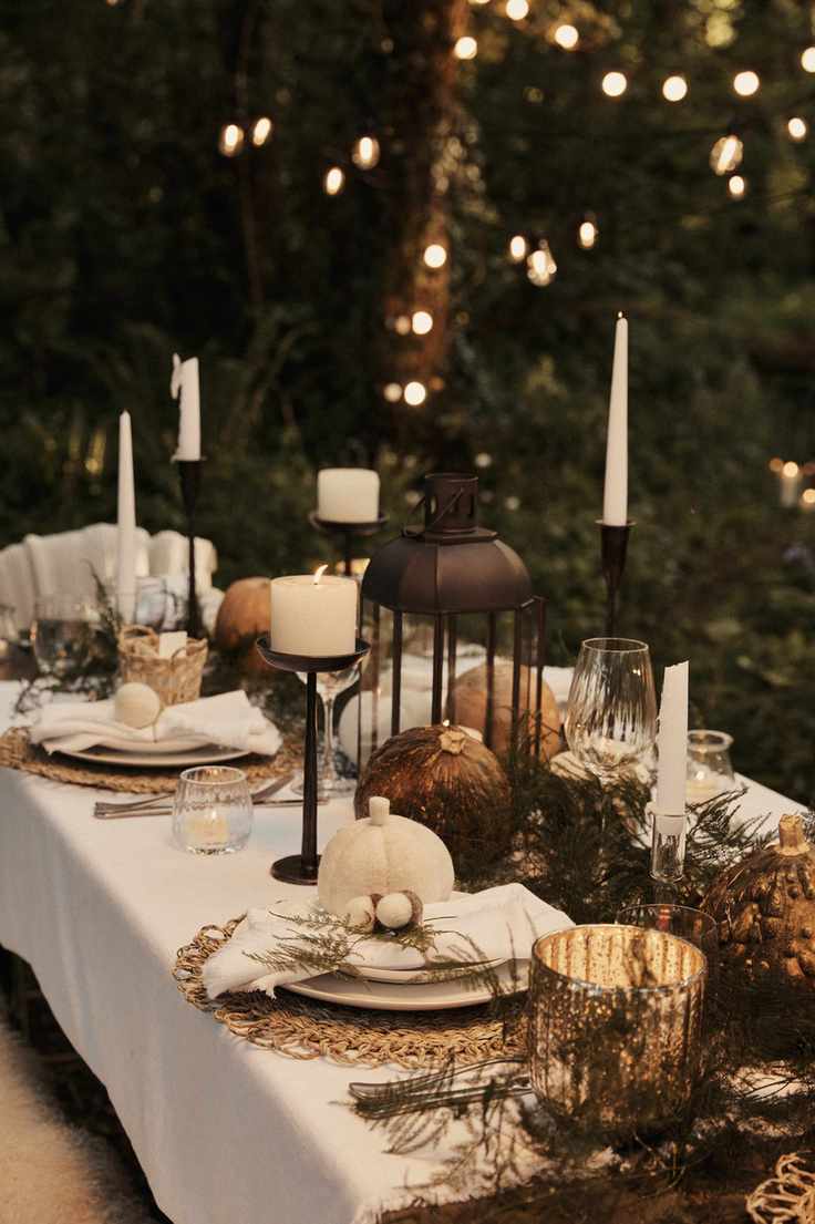 Outdoor table decor with white and orange pumpkins