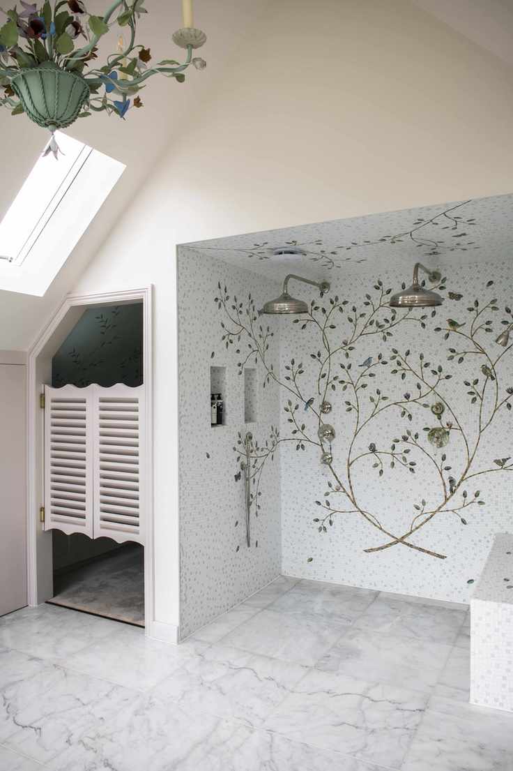 walk in shower with floral mosaic display