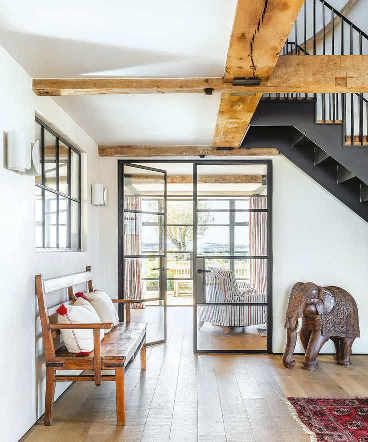 Large hallway with wooden beams and elegant decor