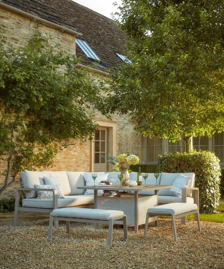 Outdoor eating area in a country home courtyard in the last of the evening sunlight