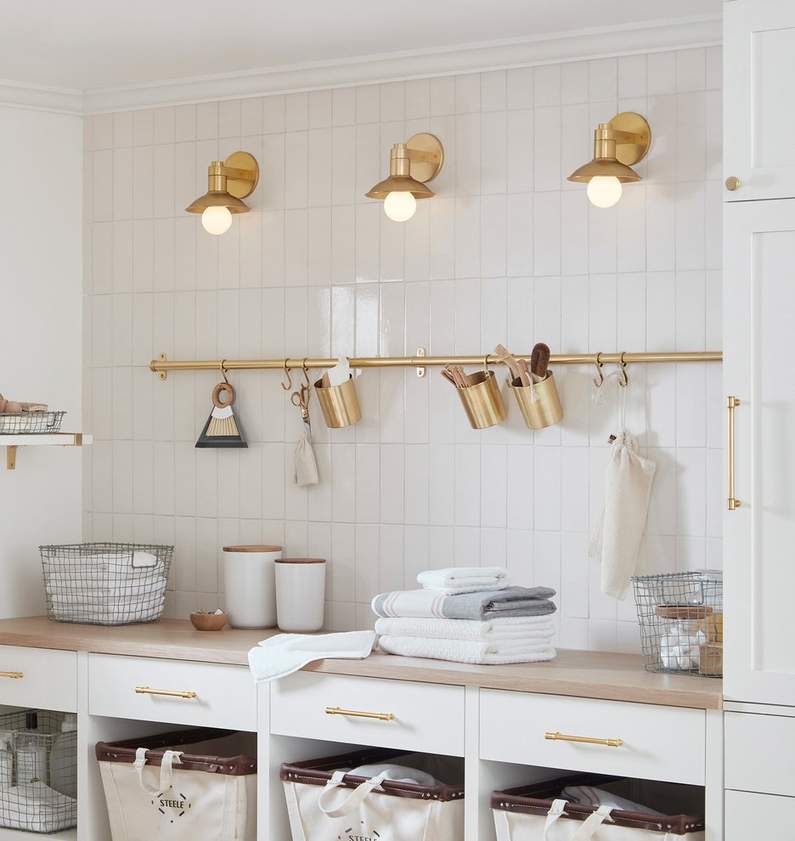 laundry room with brass storage rail