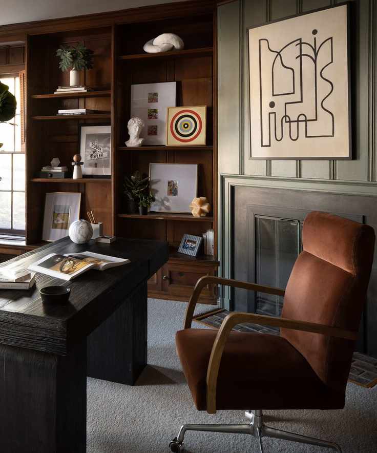 Office space dark and moody with brown and green accents