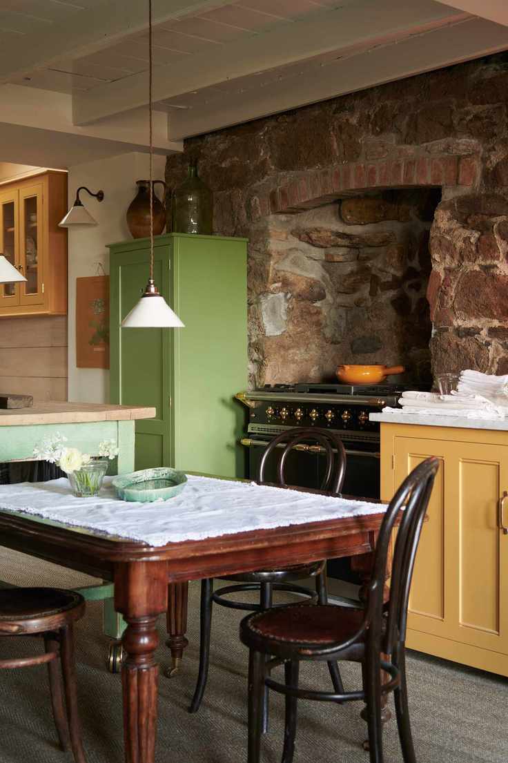 classic dark wooden table and chairs with low hanging light