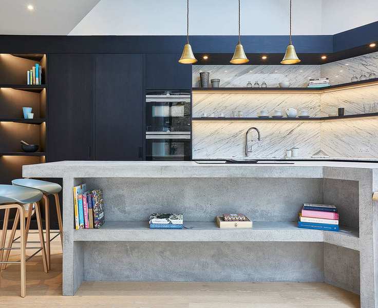 Kitchen with blue cabinets, concrete island and led lighting