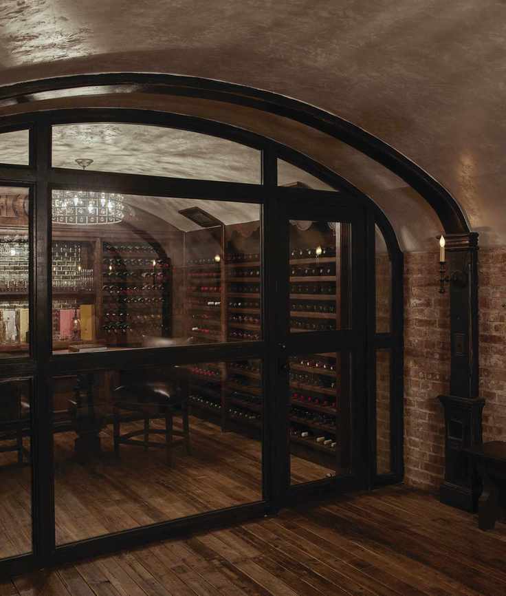 Elegant basement wine cellar with glass door