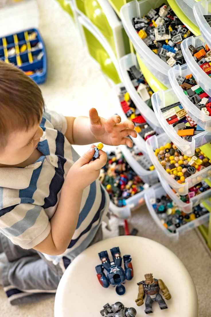 Playroom storage drawers with little boy playing in front