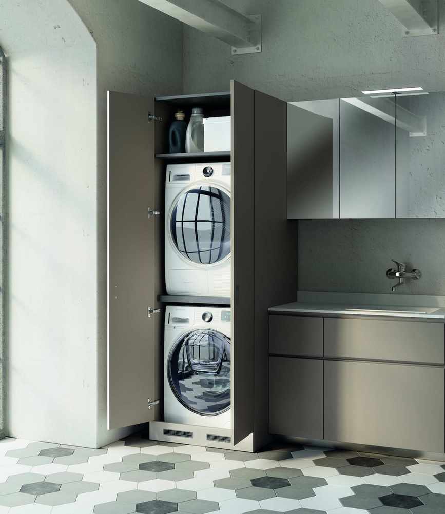 A streamlined utility room idea with stacked laundry machines.